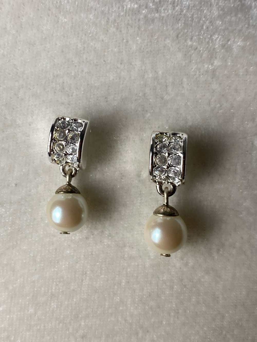 Pearl earrings.